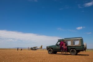Light aircraft arriving at a remote airstrip for a private East African safari